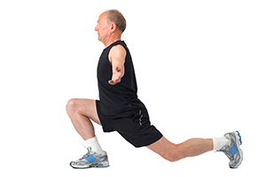 A man doing a squat exercise on a white background.